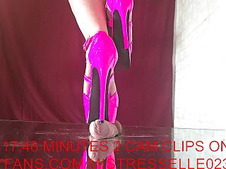 Mistress Elle tortures her slaves cock with her pink high heels